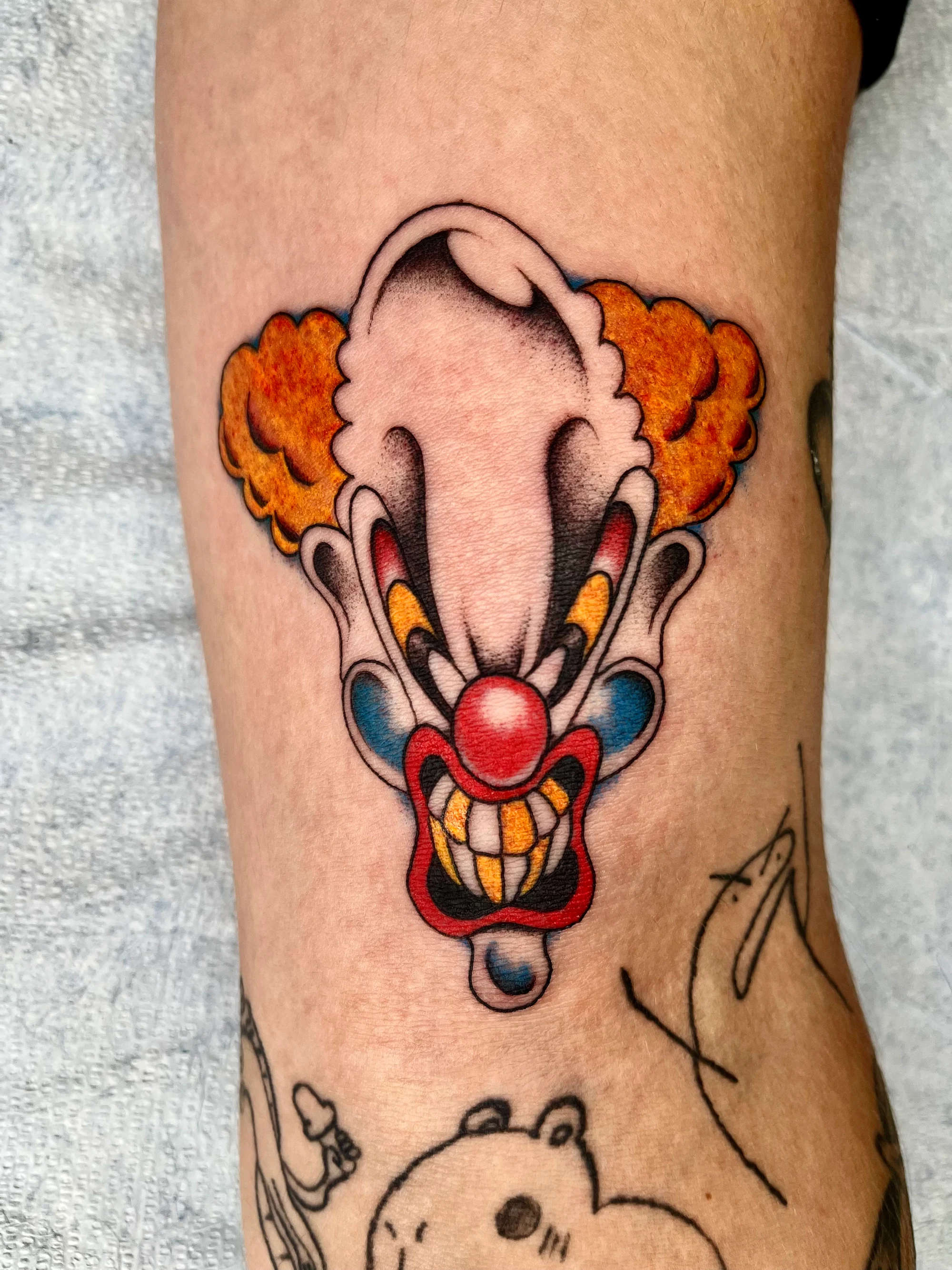 Traditional color clown head tattoo