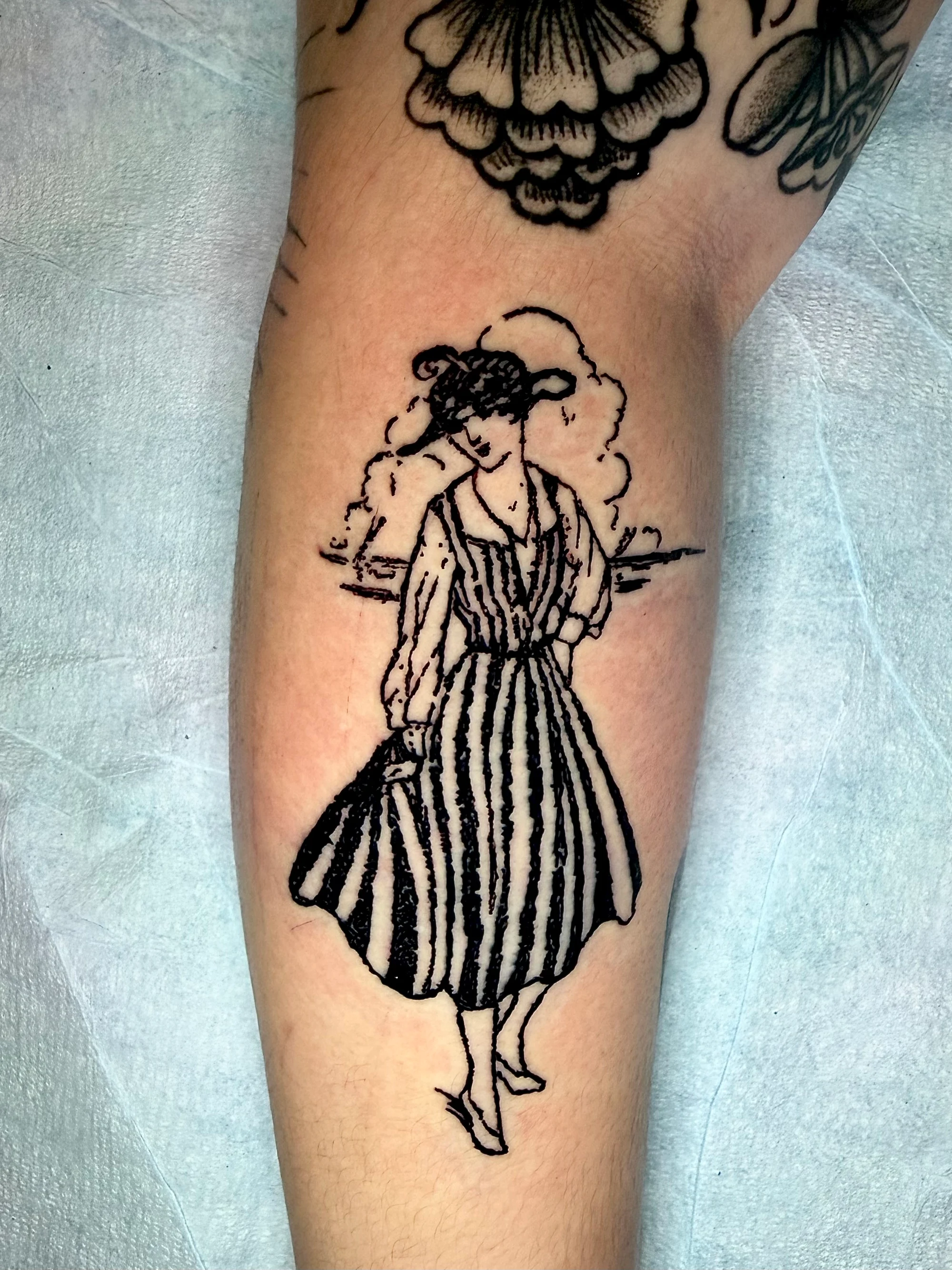 Vintage etched figure in a striped dress